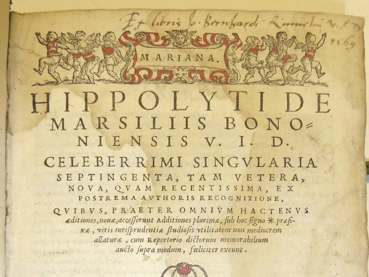 In this image there is a paper having some painting and text which is written on it.