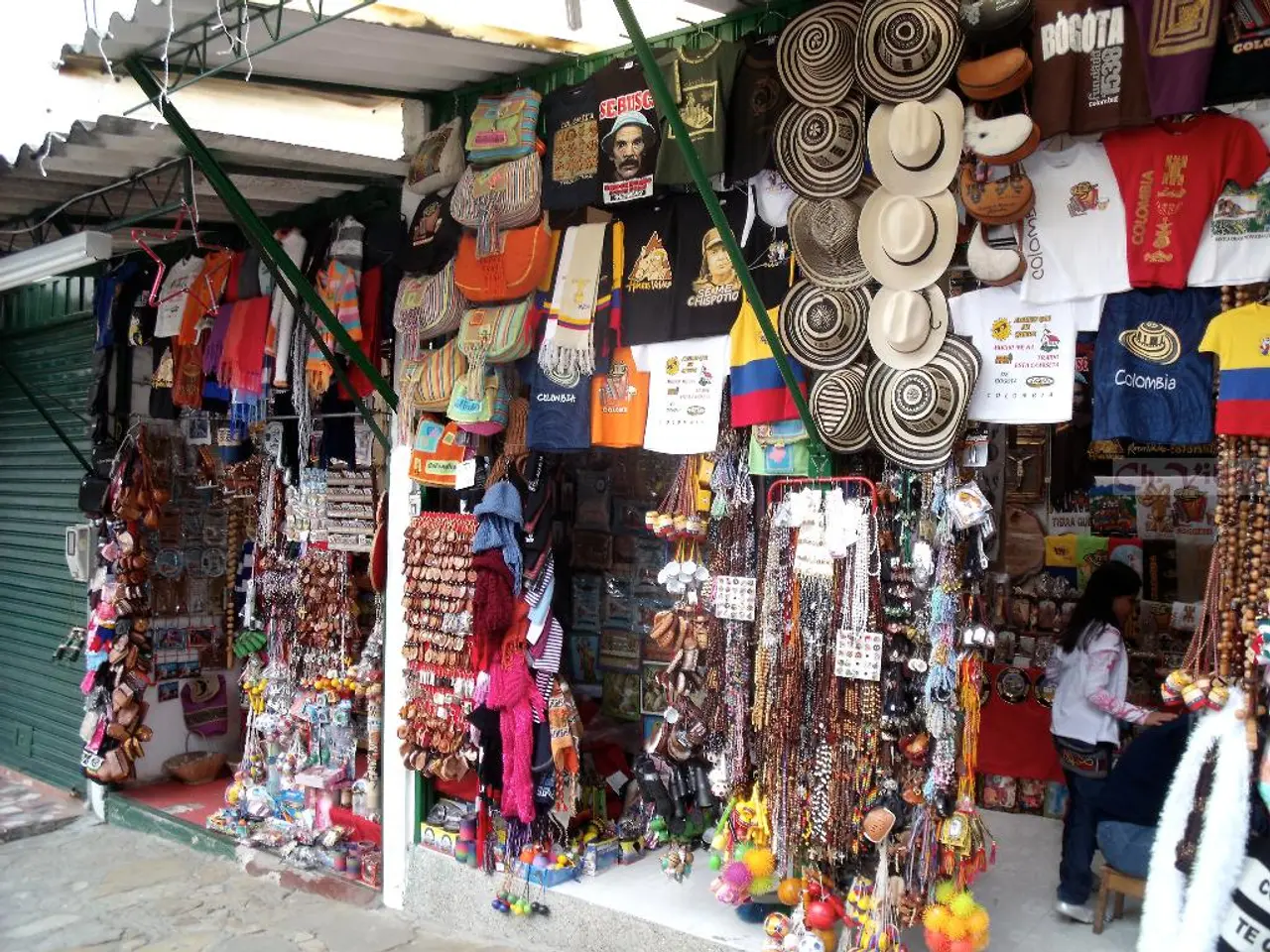In this picture i can see there is a woman standing here and there are two stores, they have caps,...