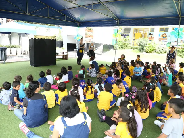This picture describes about group of people, few are seated under the tent on the grass and few...