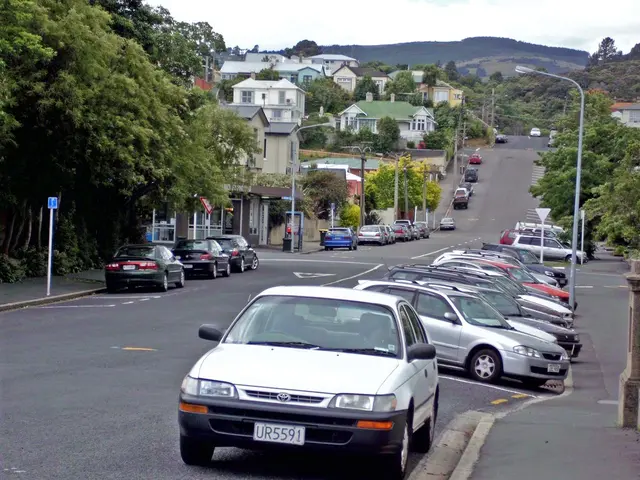 This image is clicked outside. There are trees in the middle. There are buildings in the middle....