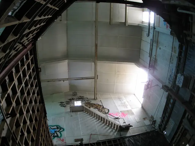 In this picture we can see an iron staircase to the wall and on the left and right side of the...