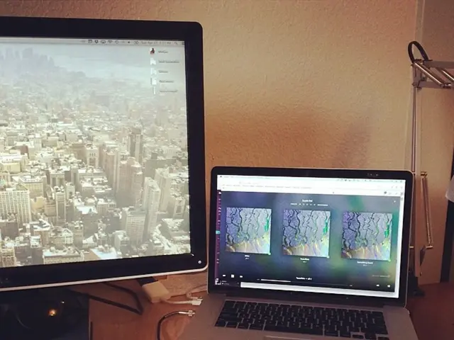 In the image we can see there are two systems and a book in front of the system. This is a cable...