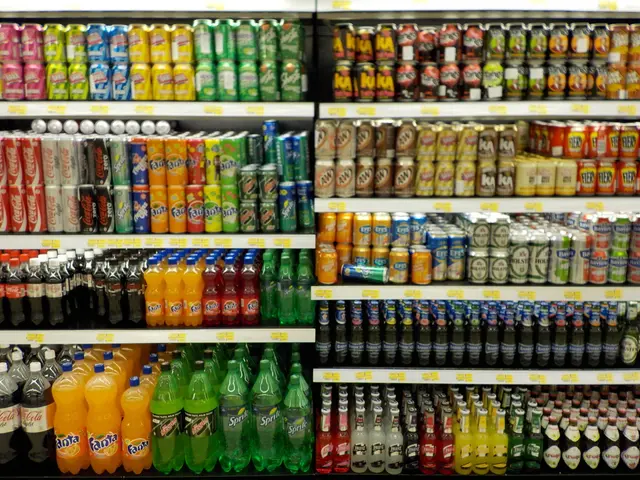 In this picture we see shelf in which drink bottles are present, there are many company bottles...