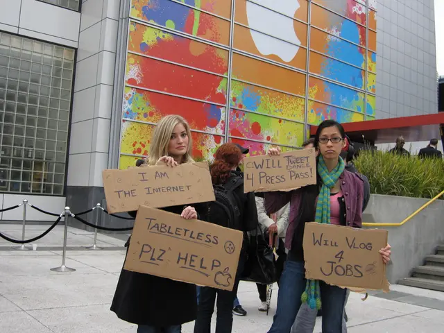 In this image there are a group of people who are holding some boards, on the boards there is text....
