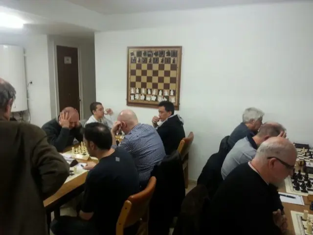 there are so many people sitting around a table is playing chess and there is a chess painting on...