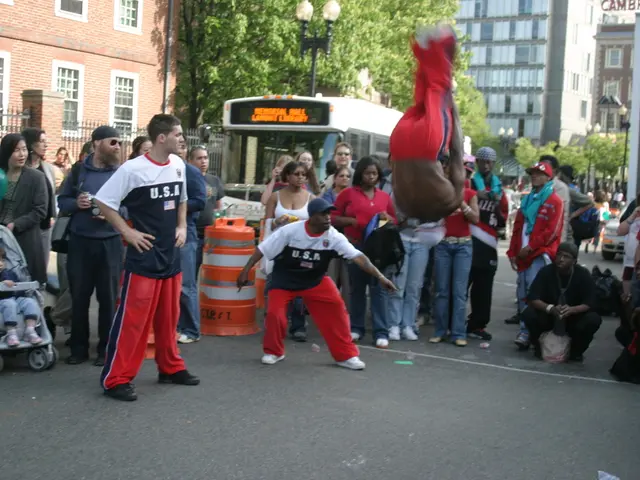 In this image we can see many people. Some are wearing caps. There is a child on a stroller. Also...